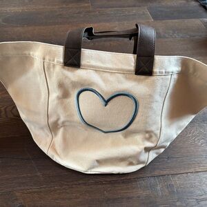 Brand new Thirty-One canvas storage bag in natural with embroidered heart.